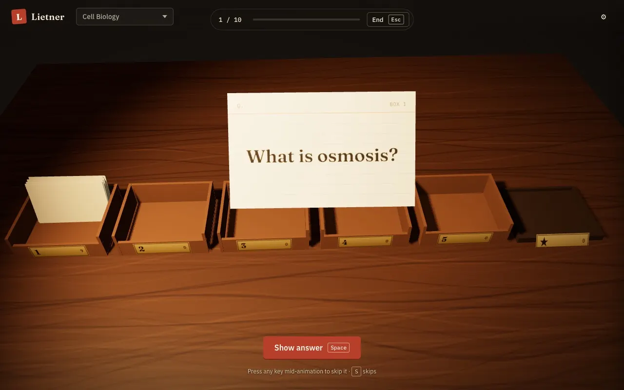 Lietner on a desktop: a flashcard lifted above five wooden boxes on a walnut desk